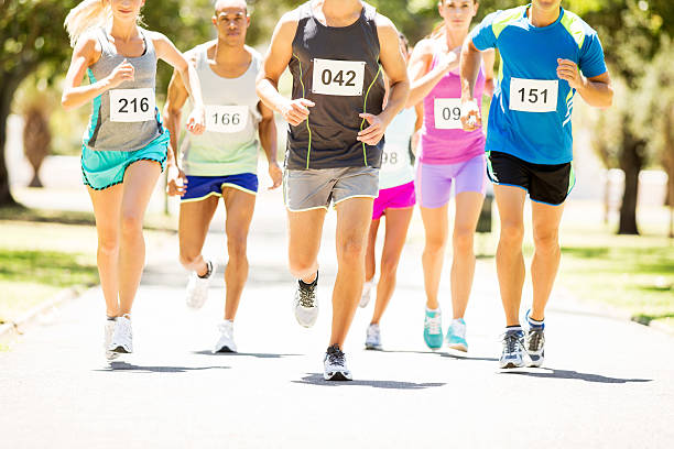 istock Men And Women Running Marathon At Park 498616643