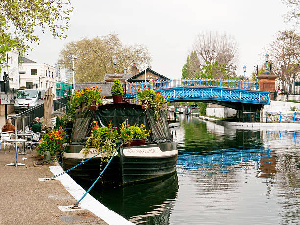 Little Venice, London London, England - April 1, 2012: A cafe narrow boat by the iron bridge in Little Venice, Paddington, West London, little venice london stock pictures, royalty-free photos & images