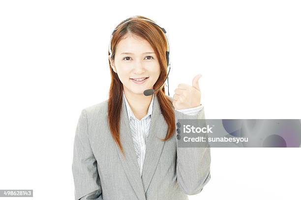 Smiling Call Center Operator With Thumbs Up Stock Photo - Download Image Now - Adult, Adults Only, Beautiful People
