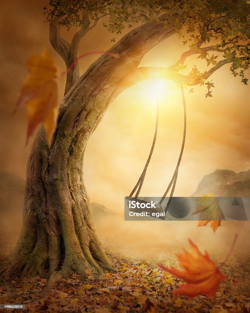 Old swing Old swing hanging from a large tree Surreal Stock Photo