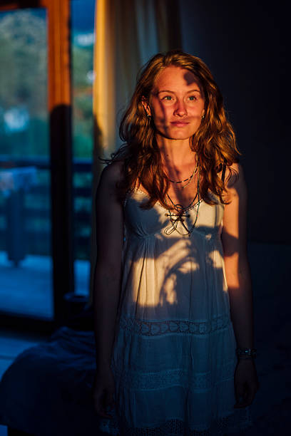istock one young woman in nightgawn standing still 498630803
