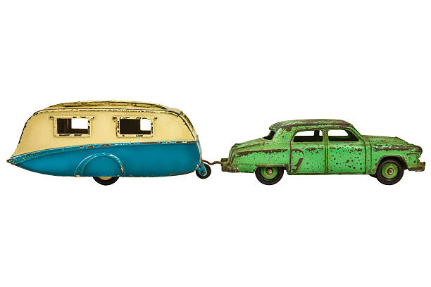 istock Vintage toy car with caravan isolated on white 498631903