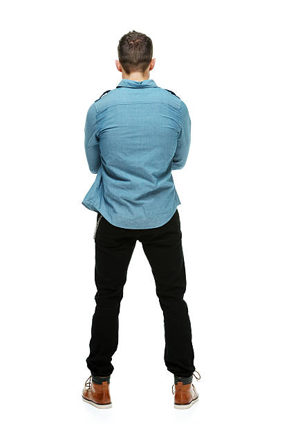 istock Rear view of hipster standing & looking away 498632309