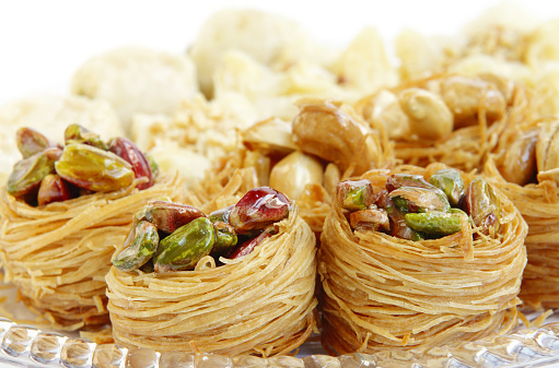 Baklava is a sweet pastry made of layers of phyllo dough filled with chopped nuts and sweetened with syrup or honey