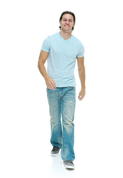 istock Front view of happy young man walking 498644965