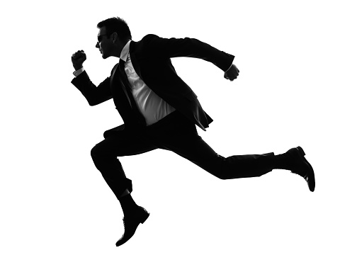 one caucasian man running secret service in silhouette on white background