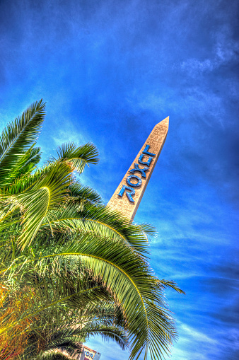 Las Vegas, USA - April 8, 2014: Obelisk with Luxor text which marks the entrance to the Luxor hotel. This is a combination of 3 bracketed images combined in HDR software to provide detail in the shadows. 