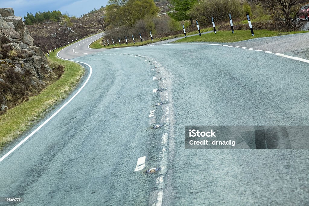 Highway Winding Through the Hills in the Scottish Highlands A winding, hilly road through the country. Accessibility Stock Photo