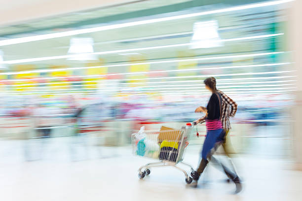 istock Couple Walking With Shopping Cart in Mall 498647821