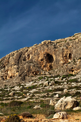 The cliffs at Ghar Lapsi in Malta are a favourite spot for rock climbers and abseilers alike.  The cliff face is spotted with numerous small caves and the view from the top is breathtaking.