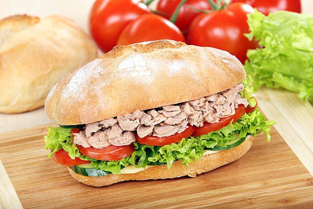 istock Sandwich with tuna on wood background 498649761