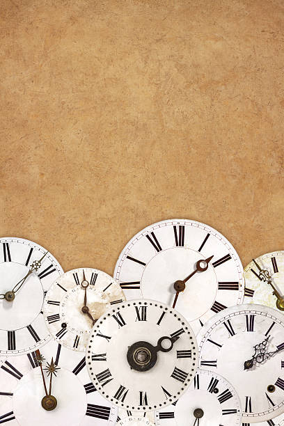 istock Set of vintage white clock faces on an ancient background 498650035