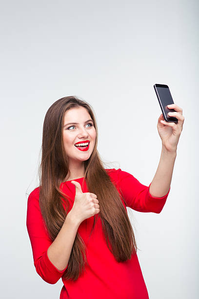 istock Cheerful woman making selfie photo 498650136