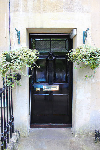istock Image of black front door on Georgian house, Bath stone 498650823