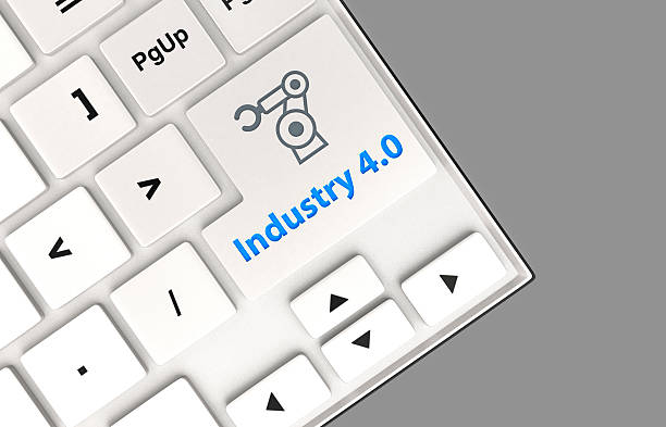 istock Robotic arm icon and word industry 4.0 on keyboard. 498653504
