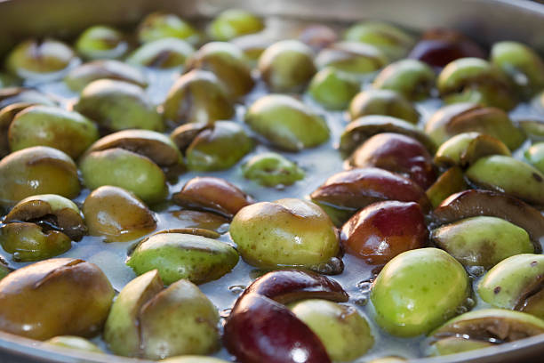 istock green olives in olive-press 498653522