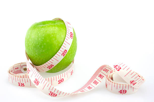 istock Green apples measured the meter, sports apples 498656816