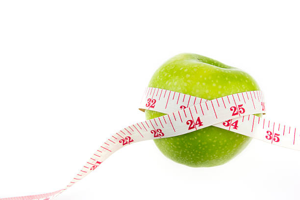 istock Green apples measured the meter, sports apples 498657164