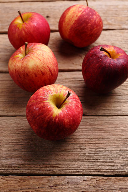 istock apples on wooden background 498658856