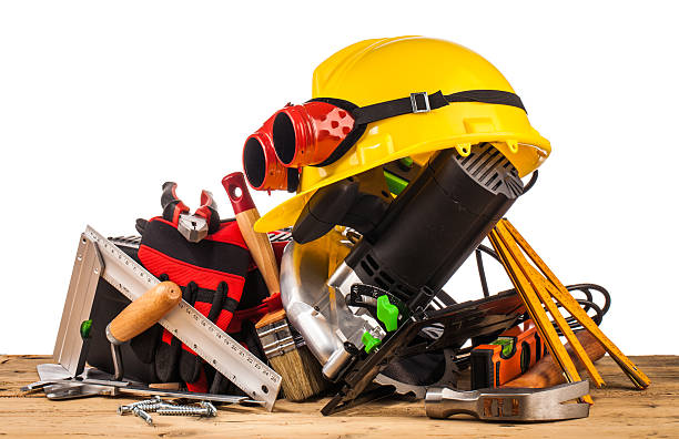 istock yellow helmet and wood mounting tools 498659240