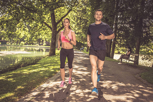 Fit and healthy female jogger running outdoors for her workout