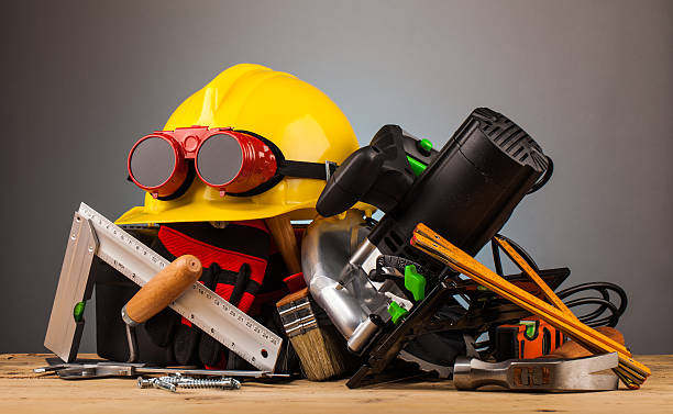istock yellow helmet and wood mounting tools 498659360