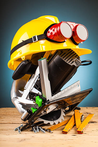 istock yellow helmet and wood mounting tools 498659390