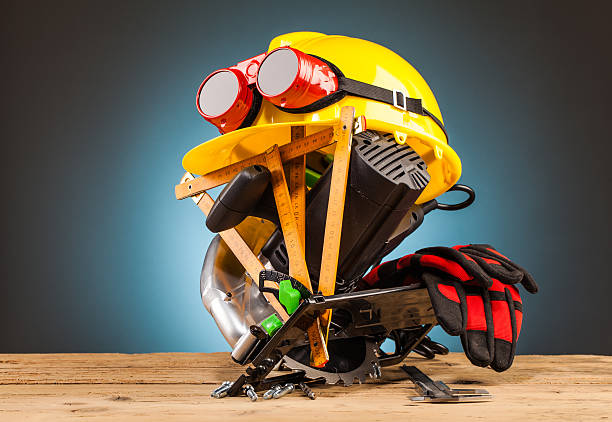 istock yellow helmet and wood mounting tools 498659418