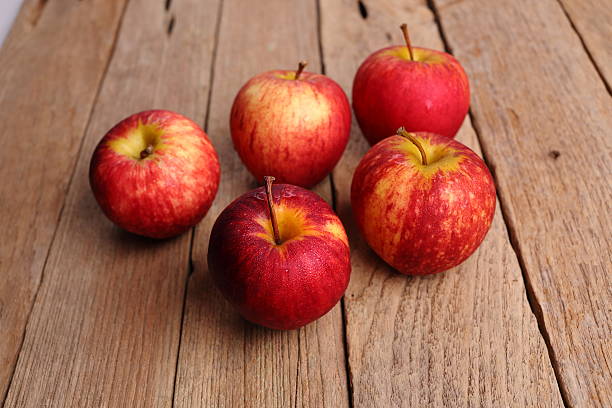 istock apples on wooden background 498659516