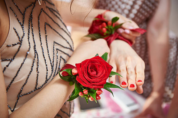 istock Bridesmaids with rose on hand helps to tie flower 498659862