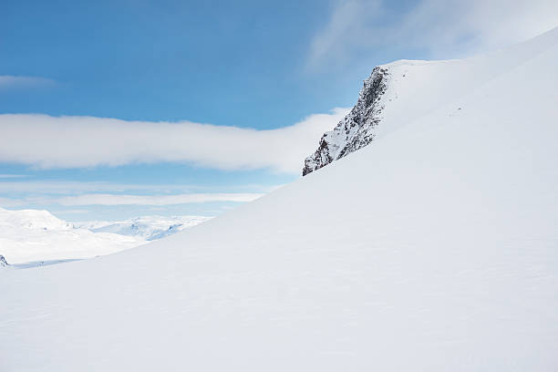 istock Approaching the summit of Mount Uranostinden in Jotunheimen, Norway 498660436