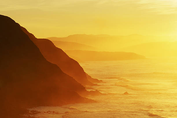 cliffs in Barrika coast with haze Cliffs in Barrika coast with haze. Basque Country sopelana stock pictures, royalty-free photos & images