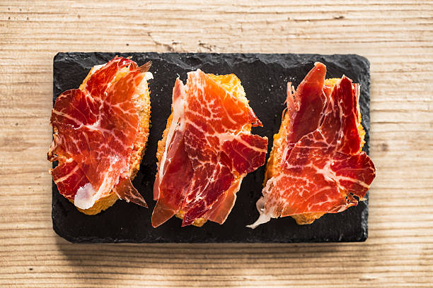 jamon iberico tapas - serrano chilli pepper meat ham spain imagens e fotografias de stock