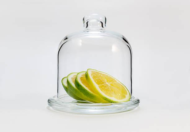istock green lemon  in a glass flask on a white background 498662062