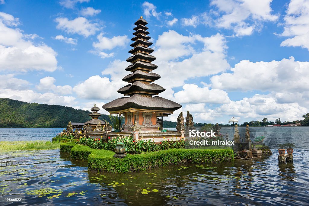 Pura Ulun Danu Bratan Temple on Bali in Indonesia Pura Ulun Danu Bratan is a major Shivaite and water temple on Bali, Indonesia. The temple complex built in 1663 is located on the shores of Lake Bratan in the mountains near Bedugul. Lake Bratan Area Stock Photo