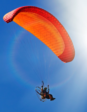 Powered paraglider flying into the sky