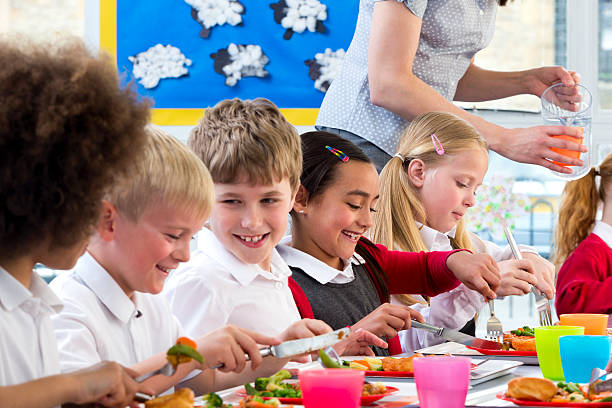 istock Children Eating School Dinners 498665611