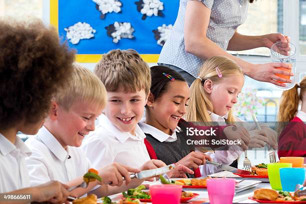 Children Eating School Dinners Stock Photo - Download Image Now - Cafeteria, Education, 8-9 Years