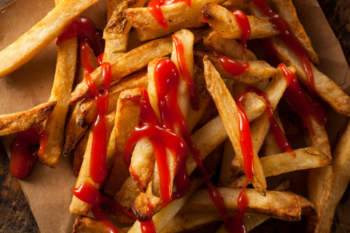Homemade French Fries Covered in Ketchup