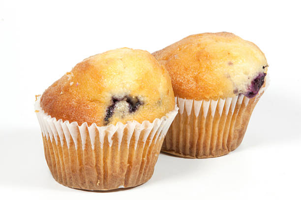 istock Two Whole Blueberry Muffins in Cupcake Cups 498668449