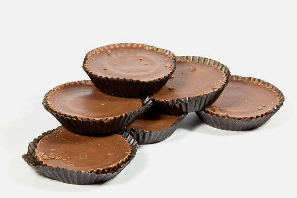 istock Pile of Six Brown Chocolates in Protective Papers 498671429