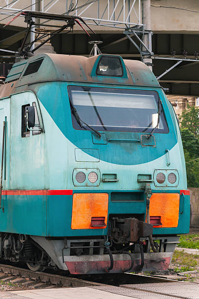 istock Modern green cargo train locomotive with red signs 498672063