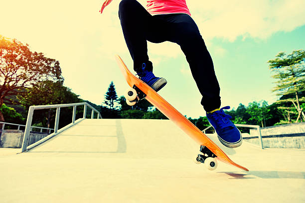 istock skateboarder jump at skatepark 498680983