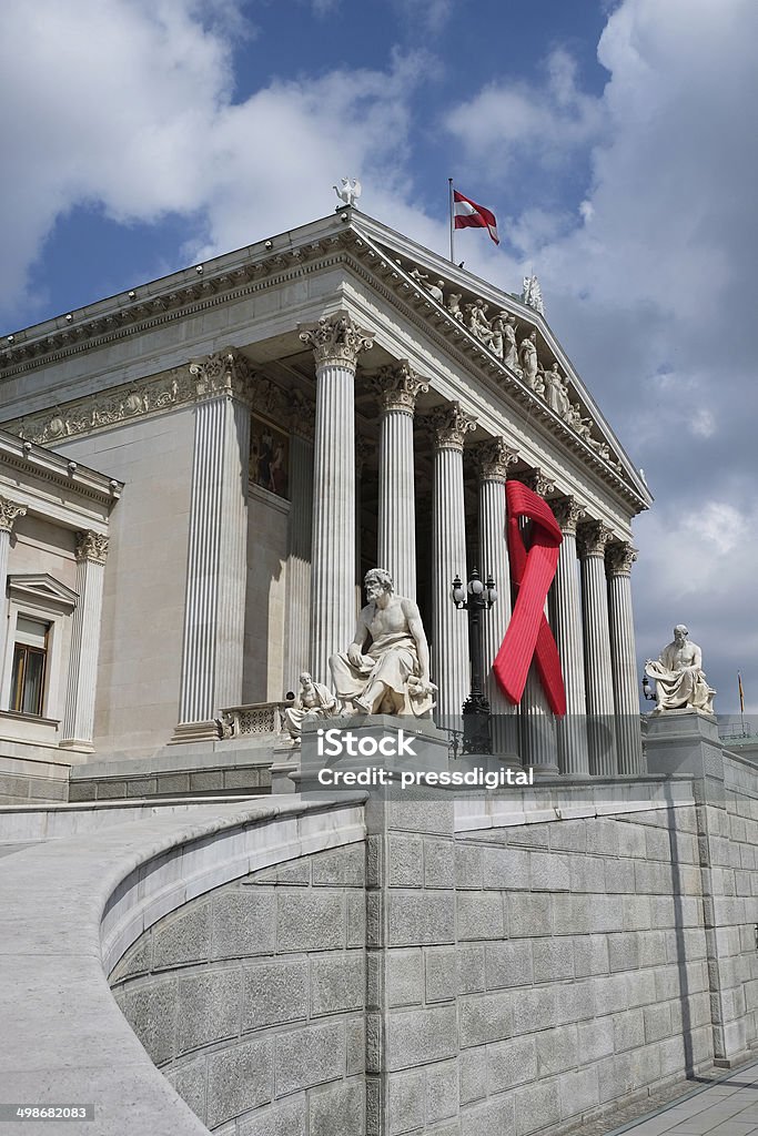 Solidarity with HIV/AIDS Solidarity with HIV/AIDS, red ribbon on the austrian parliament AIDS Stock Photo