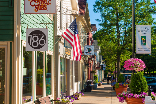 Hudson, OH, USA - June 14, 2014: Quaint shops and businesses give Hudson's Main Street a charming and inviting appearance that attracts visitors from all over Northeast Ohio.