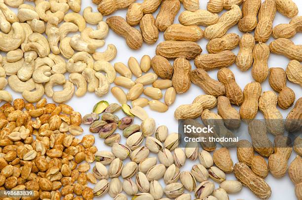 Assortiment Of Peanuts Cashews And Pistachios Stock Photo - Download Image Now - Brown, Cashew, Coating - Outer Layer