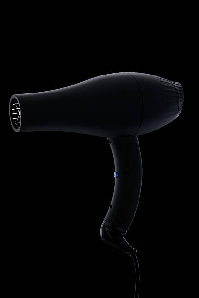 фен на черном фоне - hair dryer single object plastic black стоковые фото и изображения