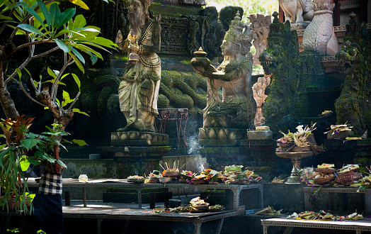 In the village of Ubud, Bali, the local market has its own temple and many people come to leave offerings called canang consisting of banana leaves, rice, flowers, and incense.