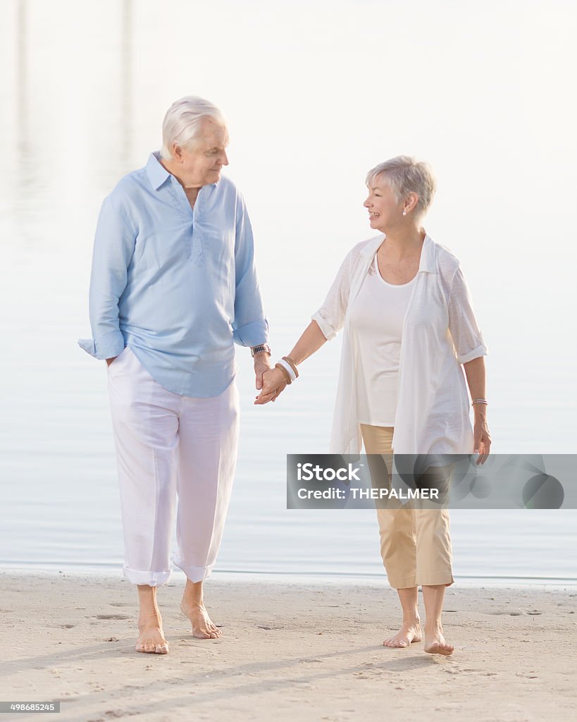 senior couple senior couple on their 70s on a beach Beach Stock Photo