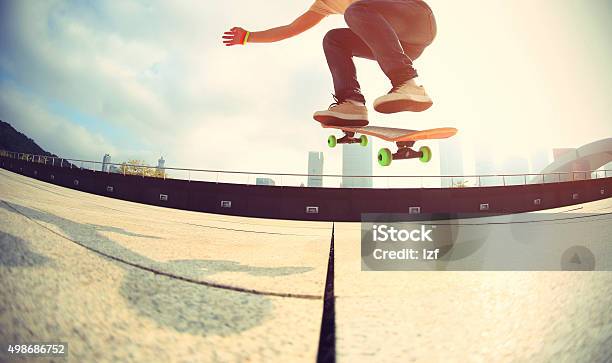 Skateboarder Skateboarding At City Stock Photo - Download Image Now - Skateboarding, Skateboard, Downtown District